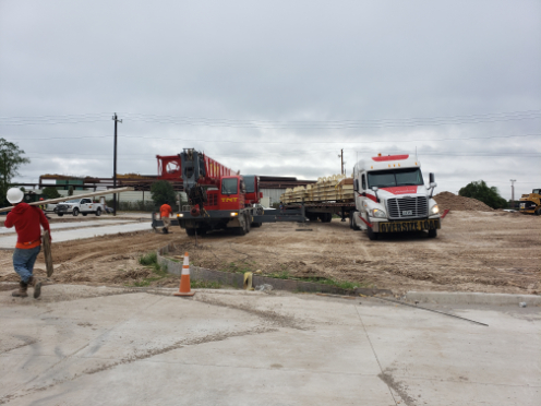 Truck scale calibration in progress at an industrial site, with heavy trucks positioned for accurate weighing and compliance testing in El Paso, TX