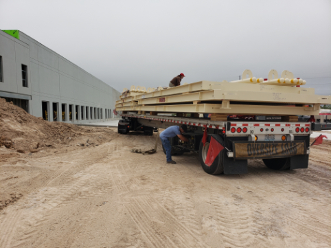 Truck scale calibration being performed on a heavy-capacity flatbed trailer at an industrial site in El Paso, TX