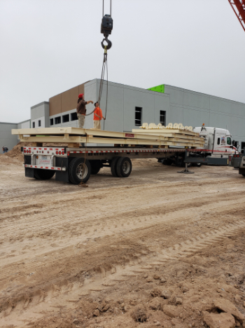 Heavy-capacity truck scale calibration using certified test weights at a commercial construction site in El Paso, TX