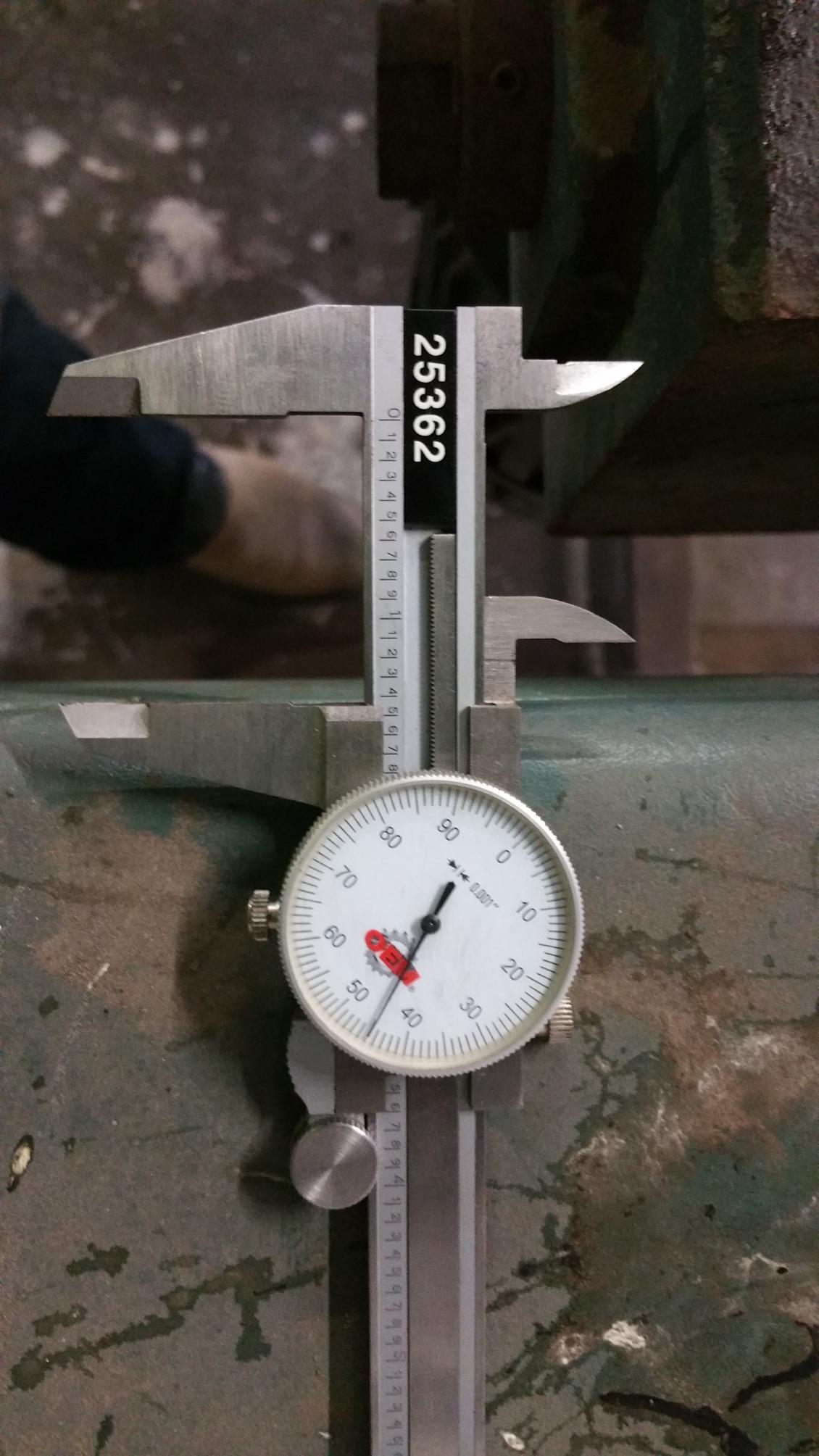 Precision laboratory scale with digital indicator being tested using certified calibration weights for accurate measurement